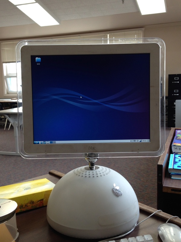 Older iMac on teacher's desk with the Lubuntu Operating System running